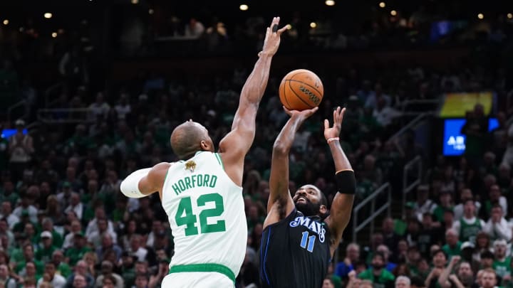 Jun 6, 2024; Boston, Massachusetts, USA; Dallas Mavericks guard Kyrie Irving (11) shoots against Boston Celtics center Al Horford (42) in the first quarter during game one of the 2024 NBA Finals at TD Garden. Mandatory Credit: David Butler II-USA TODAY Sports Jun 6, 2024; Boston, Massachusetts, USA; Dallas Mavericks guard Kyrie Irving (11) shoots against Boston Celtics center Al Horford (42) in the first quarter during game one of the 2024 NBA Finals at TD Garden. Mandatory Credit: David Butler II-USA TODAY Sports