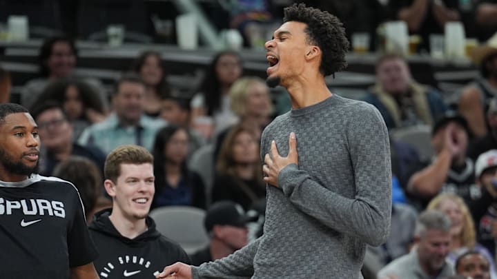 Mar 4, 2025; San Antonio, Texas, USA;  San Antonio Spurs guard Blake Wesley (14) and San Antonio Spurs center Victor Wembanyama (1) celebrate on the sideline in the second half against the Brooklyn Nets at Frost Bank Center. Mandatory Credit: Daniel Dunn-Imagn Images