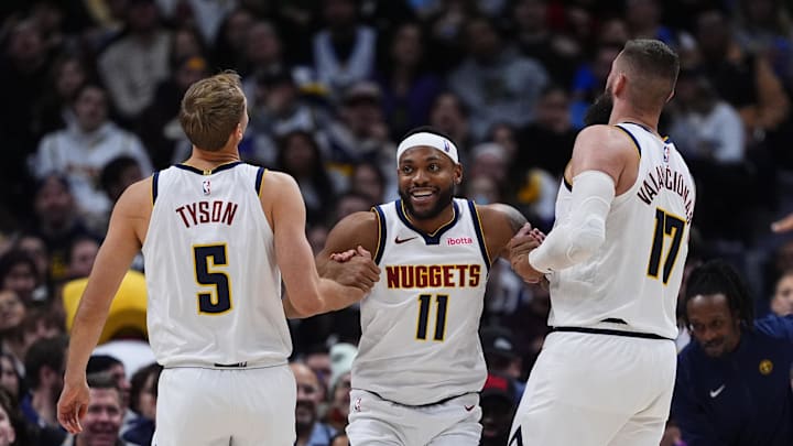 Jan 29, 2026; Denver, Colorado, USA; Denver Nuggets guard Bruce Brown (11) reacts with forward Hunter Tyson (5) and center Jonas Valanciunas (17) reacts in the second half against the Brooklyn Nets at Ball Arena.