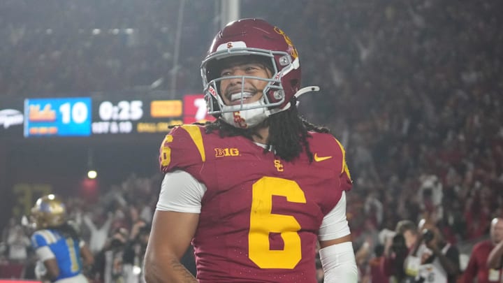Nov 29, 2025; Los Angeles, California, USA; Southern California Trojans wide receiver Makai Lemon (6) celebrates after catching a 32-yard touchdown pass against the UCLA Bruins in the second half at United Airlines Field at Los Angeles Memorial Coliseum. Mandatory Credit: Kirby Lee-Imagn Images