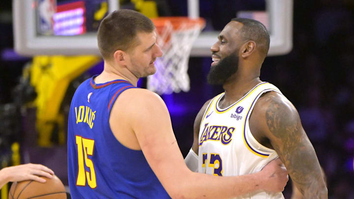Mar 2, 2024; Los Angeles, California, USA;  Los Angeles Lakers forward LeBron James (23) is greeted by Denver Nuggets center Nikola Jokic (15) at the start of the game at Crypto.com Arena.