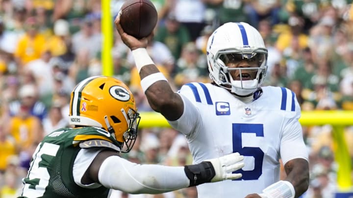 Indianapolis Colts quarterback Anthony Richardson throws a pass under pressure from Packers defensive tackle Devonte Wyatt. Indianapolis Colts quarterback Anthony Richardson throws a pass under pressure from Packers defensive tackle Devonte Wyatt.
