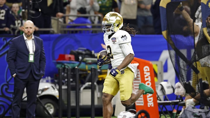 Jan 2, 2025; New Orleans, LA, USA; Notre Dame Fighting Irish wide receiver Jayden Harrison (2) celebrates after scoring a touchdown during the second half against Georgia Bulldogs at Caesars Superdome. 