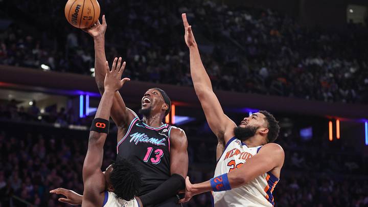 Dec 21, 2025; New York, New York, USA; Miami Heat center Bam Adebayo (13) drives past New York Knicks forward Og Anunoby (8) and New York Knicks center Karl-Anthony Towns (32) in the fourth quarter at Madison Square Garden. Mandatory Credit: Wendell Cruz-Imagn Images Dec 21, 2025; New York, New York, USA; Miami Heat center Bam Adebayo (13) drives past New York Knicks forward Og Anunoby (8) and New York Knicks center Karl-Anthony Towns (32) in the fourth quarter at Madison Square Garden. Mandatory Credit: Wendell Cruz-Imagn Images