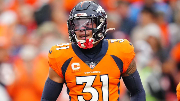 Denver Broncos safety Justin Simmons (31) reacts to a turnover in the third quarter against the Las Vegas Raiders at Empower Field at Mile High. 