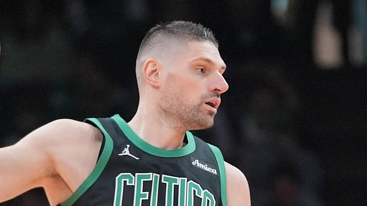 Apr 5, 2026; Boston, Massachusetts, USA; Boston Celtics center Nikola Vucevic (4) receives a pass against Toronto Raptors forward Collin Murray-Boyles (12) during the second half at TD Garden. Mandatory Credit: Gregory Fisher-Imagn Images