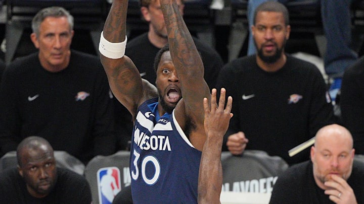 May 24, 2025; Minneapolis, Minnesota, USA; Minnesota Timberwolves forward Julius Randle (30) shoots the ball over Oklahoma City Thunder guard Luguentz Dort (5) during the first half in Game 3 of the Western Conference Finals at Target Center. Mandatory Credit: Brad Rempel-Imagn Images