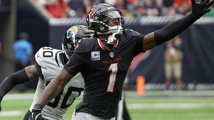 Sep 29, 2024; Houston, Texas, USA; Houston Texans wide receiver Stefon Diggs (1) drops the pass while being covered by Jacksonville Jaguars cornerback Montaric Brown (30) in the second half at NRG Stadium. Mandatory Credit: Thomas Shea-Imagn Images