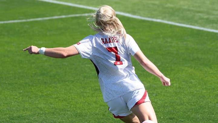 Nebraska midfielder Reagan Raabe plays a ball into the box against Iowa.