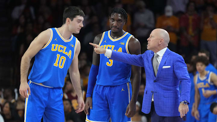Jan 27, 2025; Los Angeles, California, USA; UCLA Bruins head coach Mick Cronin talks with guard Lazar Stefanovic (10) and guard Eric Dailey Jr. (3) against the Southern California Trojans at the Galen Center. Mandatory Credit: Kirby Lee-Imagn Images