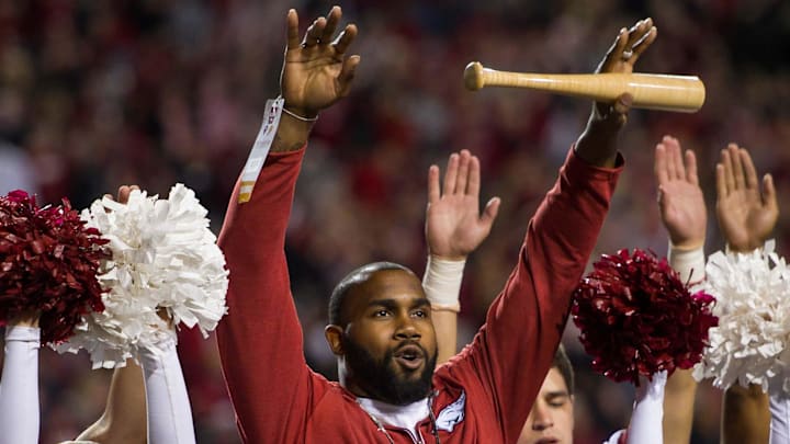 Two-time Heisman Trophy runnerup Darren McFadden "brings the wood" while being honored Nov. 12, 2016, during a break in the Arkansas Razorbacks game against the LSU Tigers at Donald W. Reynolds Razorback Stadium. 