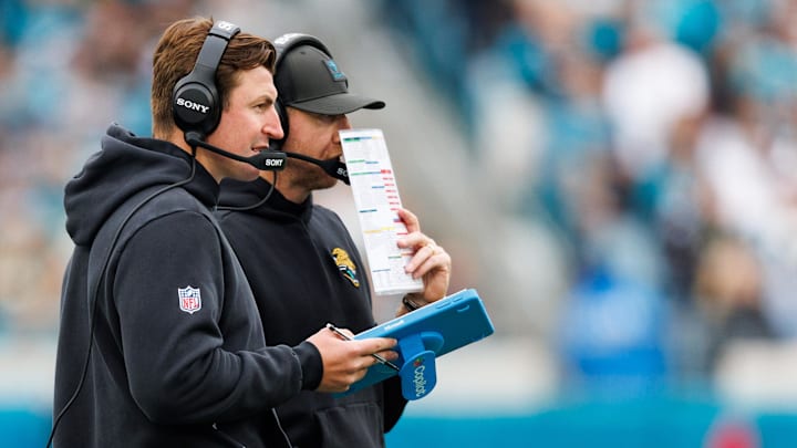Jan 4, 2026; Jacksonville, Florida, USA; Jacksonville Jaguars offensive coordinator Grant Udinski and head coach Liam Coen during the second quarter against the Tennessee Titans at EverBank Stadium. Mandatory Credit: Morgan Tencza-Imagn Images