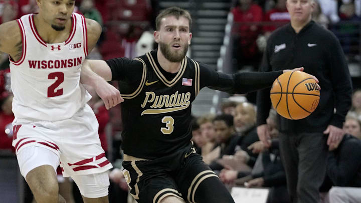 Purdue guard Braden Smith (3) drives past Wisconsin guard Nick Boyd (2).