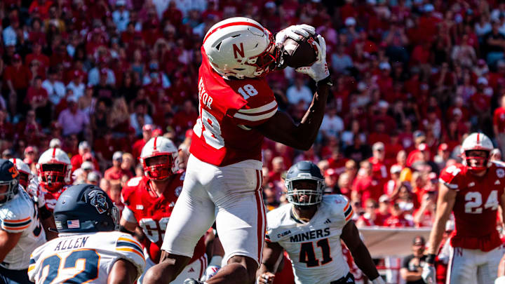 Aug 31, 2024; Lincoln, Nebraska, USA; Nebraska Cornhuskers wide receiver Isaiah Neyor (18) catches a pass against UTEP Miners linebacker Josiah Allen (22) during the second quarter at Memorial Stadium. Mandatory Credit: Dylan Widger-Imagn Images Aug 31, 2024; Lincoln, Nebraska, USA; Nebraska Cornhuskers wide receiver Isaiah Neyor (18) catches a pass against UTEP Miners linebacker Josiah Allen (22) during the second quarter at Memorial Stadium. Mandatory Credit: Dylan Widger-Imagn Images