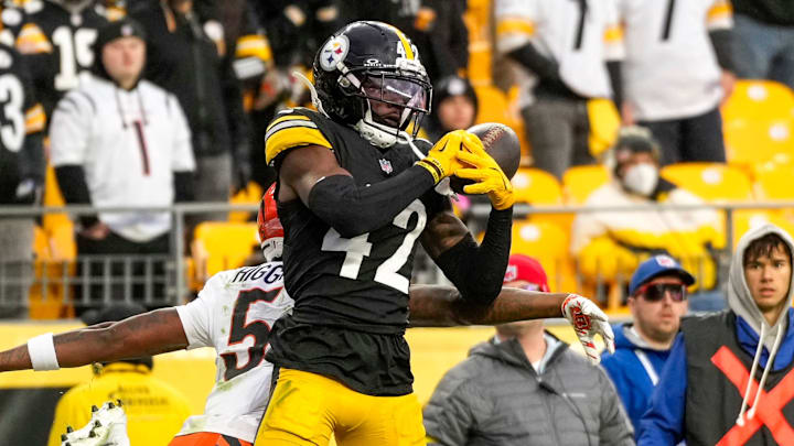 Pittsburgh Steelers cornerback James Pierre (42) intercepted a pass to Cincinnati Bengals wide receiver Tee Higgins (5) in the fourth quarter of the NFL Week 11 game between the Pittsburgh Steelers and the Cincinnati Bengals at Acrisure Stadium in Pittsburgh on Sunday, Nov. 16, 2025. The Bengals lost 34-12.