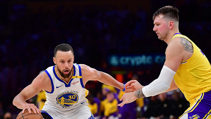 Apr 3, 2025; Los Angeles, California, USA; Golden State Warriors guard Stephen Curry (30) controls the ball against Los Angeles Lakers guard Luka Doncic (77) during the second half at Crypto.com Arena. Mandatory Credit: Gary A. Vasquez-Imagn Images Apr 3, 2025; Los Angeles, California, USA; Golden State Warriors guard Stephen Curry (30) controls the ball against Los Angeles Lakers guard Luka Doncic (77) during the second half at Crypto.com Arena. Mandatory Credit: Gary A. Vasquez-Imagn Images