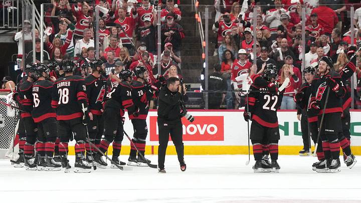 May 29, 2026; Raleigh, North Carolina, USA; Carolina Hurricanes players celebrate with their fans after defeating the Montreal Canadiens in game five of the Eastern Conference Final of the 2026 Stanley Cup Playoffs at Lenovo Center. Mandatory Credit: James Guillory-Imagn Images