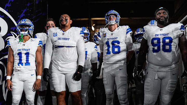From left, Detroit Lions wide receiver Kalif Raymond (11), right tackle Penei Sewell (58), quarterback Jared Goff (16) 