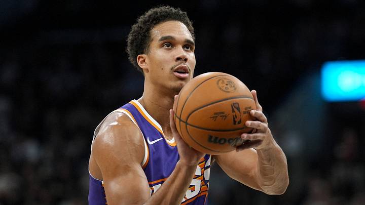 Mar 19, 2026; San Antonio, Texas, USA;  Phoenix Suns forward Oso Ighodaro (11) shoots a free throw in the first half against the San Antonio Spurs at Frost Bank Center. Mandatory Credit: Daniel Dunn-Imagn Images