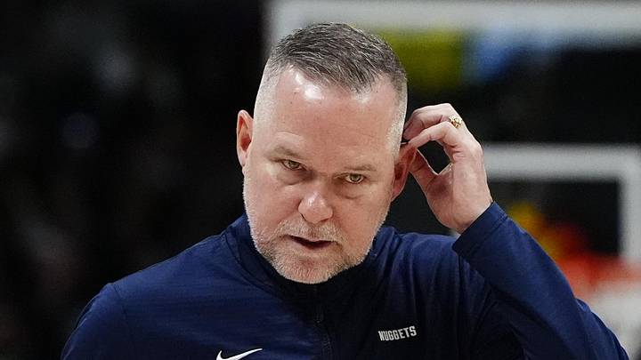 Mar 15, 2025; Denver, Colorado, USA; Denver Nuggets head coach Michael Malone following a timeout in the fourth quarter against the Washington Wizards at Ball Arena. Mandatory Credit: Ron Chenoy-Imagn Images
