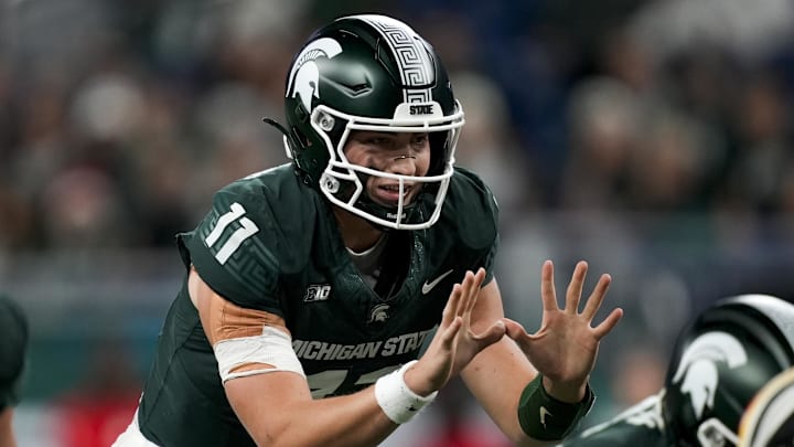 Nov 29, 2025; Detroit, Michigan, USA; Michigan State quarterback Alessio Milivojevic (11) prepares to take a snap in the first quarter against Maryland at Ford Field. Mandatory Credit: Brendan Mullin-Imagn Images Nov 29, 2025; Detroit, Michigan, USA; Michigan State quarterback Alessio Milivojevic (11) prepares to take a snap in the first quarter against Maryland at Ford Field. Mandatory Credit: Brendan Mullin-Imagn Images