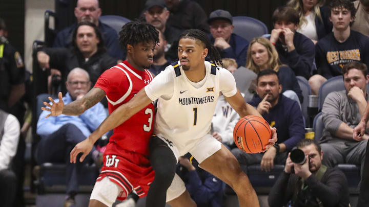 Feb 18, 2026; Morgantown, West Virginia, USA; West Virginia Mountaineers guard Jasper Floyd (1) backs down Utah Utes guard Don McHenry (3) during the first half at Hope Coliseum. Mandatory Credit: Ben Queen-Imagn Images Feb 18, 2026; Morgantown, West Virginia, USA; West Virginia Mountaineers guard Jasper Floyd (1) backs down Utah Utes guard Don McHenry (3) during the first half at Hope Coliseum. Mandatory Credit: Ben Queen-Imagn Images