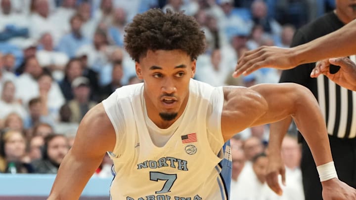 Nov 7, 2025; Chapel Hill, North Carolina, USA; North Carolina Tar Heels guard Seth Trimble (7) with the ball as Kansas Jayhawks guard Elmarko Jackson (13) defends in the second half at Dean E. Smith Center. Mandatory Credit: Bob Donnan-Imagn Images Nov 7, 2025; Chapel Hill, North Carolina, USA; North Carolina Tar Heels guard Seth Trimble (7) with the ball as Kansas Jayhawks guard Elmarko Jackson (13) defends in the second half at Dean E. Smith Center. Mandatory Credit: Bob Donnan-Imagn Images