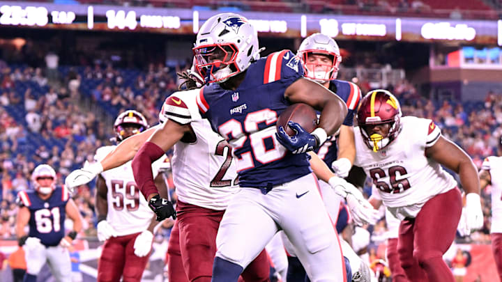 Aug 8, 2025; Foxborough, Massachusetts, USA; New England Patriots running back Terrell Jennings (26) scores a touchdown against the Washington Commanders during the second half at Gillette Stadium. Mandatory Credit: Brian Fluharty-Imagn Images