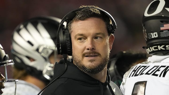 Nov 16, 2024; Madison, Wisconsin, USA;  Oregon Ducks head coach Dan Lanning looks on during the third quarter against the Wisconsin Badgers at Camp Randall Stadium. 