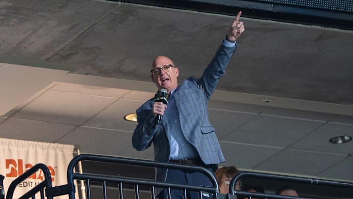 Apr 15, 2025; Saint Paul, Minnesota, USA; The Minnesota Gophers head coach Bob Motzko leads the crowd in a “Let’s play hockey” cheer before the game between the Minnesota Wild and Anaheim Ducks at Xcel Energy Center. Mandatory Credit: Matt Blewett-Imagn Images