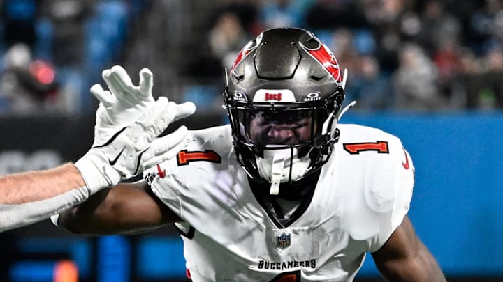 Tampa Bay Buccaneers running back Rachaad White (1) with the ball as Carolina Panthers linebacker Josey Jewell (47) defends.