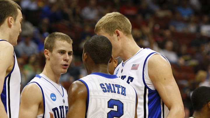 Mar 19, 2010; Jacksonville, FL, USA; Duke Blue Devils guard Jon Scheyer (30) talks with forward Miles Plumlee (21) and guard Nolan Smith (2) during the first half against the Arkansas-Pine Bluff Golden Lions in the first round of the 2010 NCAA mens basketball tournament at Jacksonville Veterans Memorial Arena.  Mandatory Credit: Kim Klement-Imagn Images