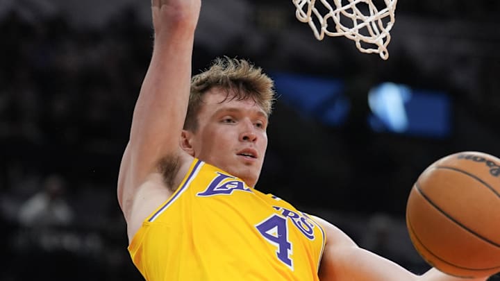 Nov 27, 2024; San Antonio, Texas, USA;  Los Angeles Lakers guard Dalton Knecht (4) dunks in the second half against the San Antonio Spurs at Frost Bank Center. Mandatory Credit: Daniel Dunn-Imagn Images
