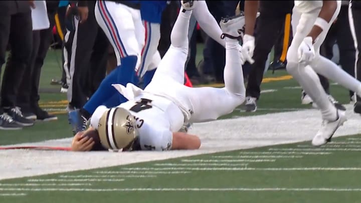 Carr suffered an injury after attempting to dive for a first down. Carr suffered an injury after attempting to dive for a first down.