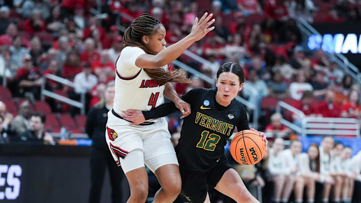 Vermont Catamounts guard Keira Hanson (12) tries to drive past Louisville Cardinals forward MacKenly Randolph (4) at the 2026 NCAA Women's March Madness basketball tournament at the KFC Yum Center In Louisville, Kentucky. March 21, 2026. Vermont Catamounts guard Keira Hanson (12) tries to drive past Louisville Cardinals forward MacKenly Randolph (4) at the 2026 NCAA Women's March Madness basketball tournament at the KFC Yum Center In Louisville, Kentucky. March 21, 2026.