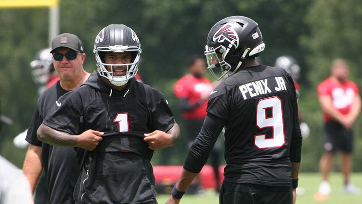 Tua Tagovailoa and Michael Penix Jr. working together at Atlanta Falcons OTAs.