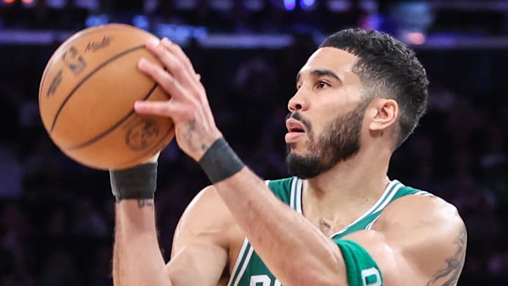 Boston Celtics forward Jayson Tatum looks to shoot a basket.