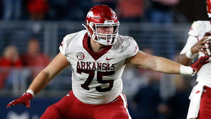 Arkansas Razorbacks offensive linemen Patrick Kutas (75) blocks during the second half against the Ole Miss Rebels at Vaught-Hemingway Stadium. 
