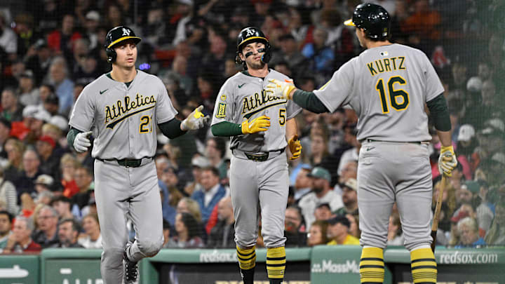 Sep 17, 2025; Boston, Massachusetts, USA; Athletics left fielder Tyler Soderstrom (21) and shortstop Jacob Wilson (5) celebrate scoring runs against the Boston Red Sox with first baseman Nick Kurtz (16) during the fifth inning at Fenway Park. Mandatory Credit: Eric Canha-Imagn Images Sep 17, 2025; Boston, Massachusetts, USA; Athletics left fielder Tyler Soderstrom (21) and shortstop Jacob Wilson (5) celebrate scoring runs against the Boston Red Sox with first baseman Nick Kurtz (16) during the fifth inning at Fenway Park. Mandatory Credit: Eric Canha-Imagn Images