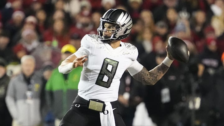 Nov 16, 2024; Madison, Wisconsin, USA;  Oregon Ducks quarterback Dillon Gabriel (8) throws a pass during the first quarter against the Wisconsin Badgers at Camp Randall Stadium. Mandatory Credit: Jeff Hanisch-Imagn Images