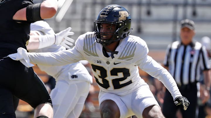 Purdue Boilermakers tight end Ben Furtney (41) is blocked by Purdue Boilermakers defensive back Joseph Jefferson II (32) during the spring football game, Saturday, April 13, 2024, at Ross-Ade Stadium in West Lafayette, Ind.