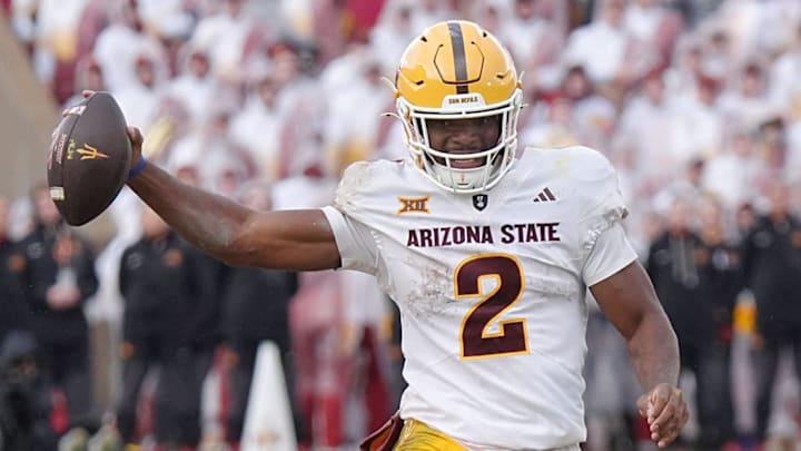 Arizona State Sun Devils quarterback Jeff Sims (2) breaks tackle from Iowa State Cyclones' defensive line Domonique Orange (95) and runs for a first down during the fourth quarter in the Big-12 showdown at jack Trice Stadium on Nov. 1, 2025, in Ames, Iowa.