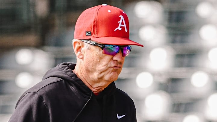 Dave Van Horn holds a clipboard during Saturday's preseason scrimmage 