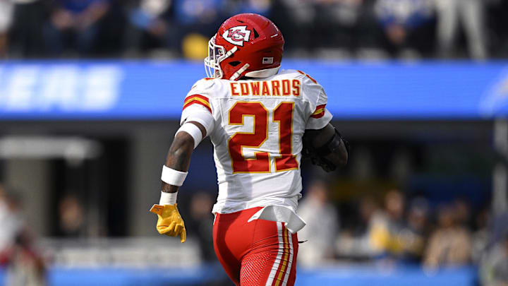 Jan 7, 2024; Inglewood, California, USA; Kansas City Chiefs safety Mike Edwards (21) returns a fumble for a touchdown during the first half against the Los Angeles Chargers at SoFi Stadium. Mandatory Credit: Orlando Ramirez-Imagn Images Jan 7, 2024; Inglewood, California, USA; Kansas City Chiefs safety Mike Edwards (21) returns a fumble for a touchdown during the first half against the Los Angeles Chargers at SoFi Stadium. Mandatory Credit: Orlando Ramirez-Imagn Images