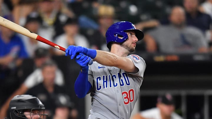 Jul 26, 2025; Chicago, Illinois, USA; Chicago Cubs right fielder Kyle Tucker (30) hits a single during the ninth inning against the Chicago White Sox at Rate Field. 