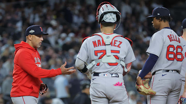 Oct 1, 2025; Bronx, New York, USA; Boston Red Sox manager Alex Cora (13) makes a pitching change during the third inning against the New York Yankees during game two of the Wildcard round for the 2025 MLB playoffs at Yankee Stadium. Mandatory Credit: Brad Penner-Imagn Images