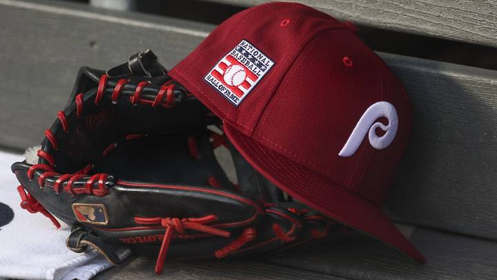 Jul 25, 2025; Bronx, New York, USA; A detailed view of a Hall of Fame patch on a Philadelphia Phillies hat resting in the dugout during the second inning against the New York Yankees at Yankee Stadium. Jul 25, 2025; Bronx, New York, USA; A detailed view of a Hall of Fame patch on a Philadelphia Phillies hat resting in the dugout during the second inning against the New York Yankees at Yankee Stadium.