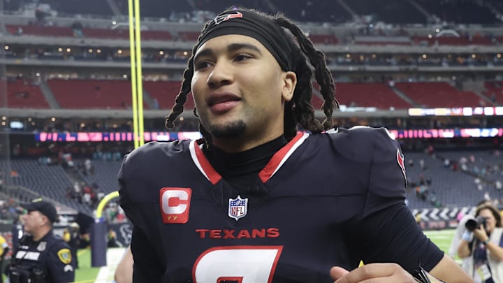 Dec 15, 2024; Houston, Texas, USA; Houston Texans quarterback C.J. Stroud (7) runs off the field after defeating the Miami Dolphins at NRG Stadium. Mandatory Credit: Thomas Shea-Imagn Images