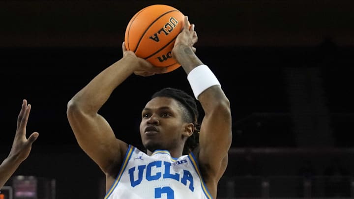 Dec 3, 2024; Los Angeles, California, USA; UCLA Bruins guard Dylan Andrews (2) shoots the ball against the Washington Huskies at Pauley Pavilion presented by Wescom. Mandatory Credit: Kirby Lee-Imagn Images