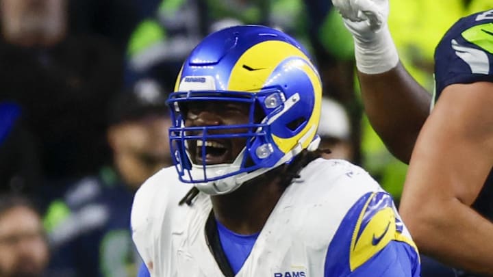 Nov 3, 2024; Seattle, Washington, USA; Los Angeles Rams defensive tackle Bobby Brown III (95) celebrates following a fourth down stop by the Rams against the Seattle Seahawks during overtime at Lumen Field. Mandatory Credit: Joe Nicholson-Imagn Images